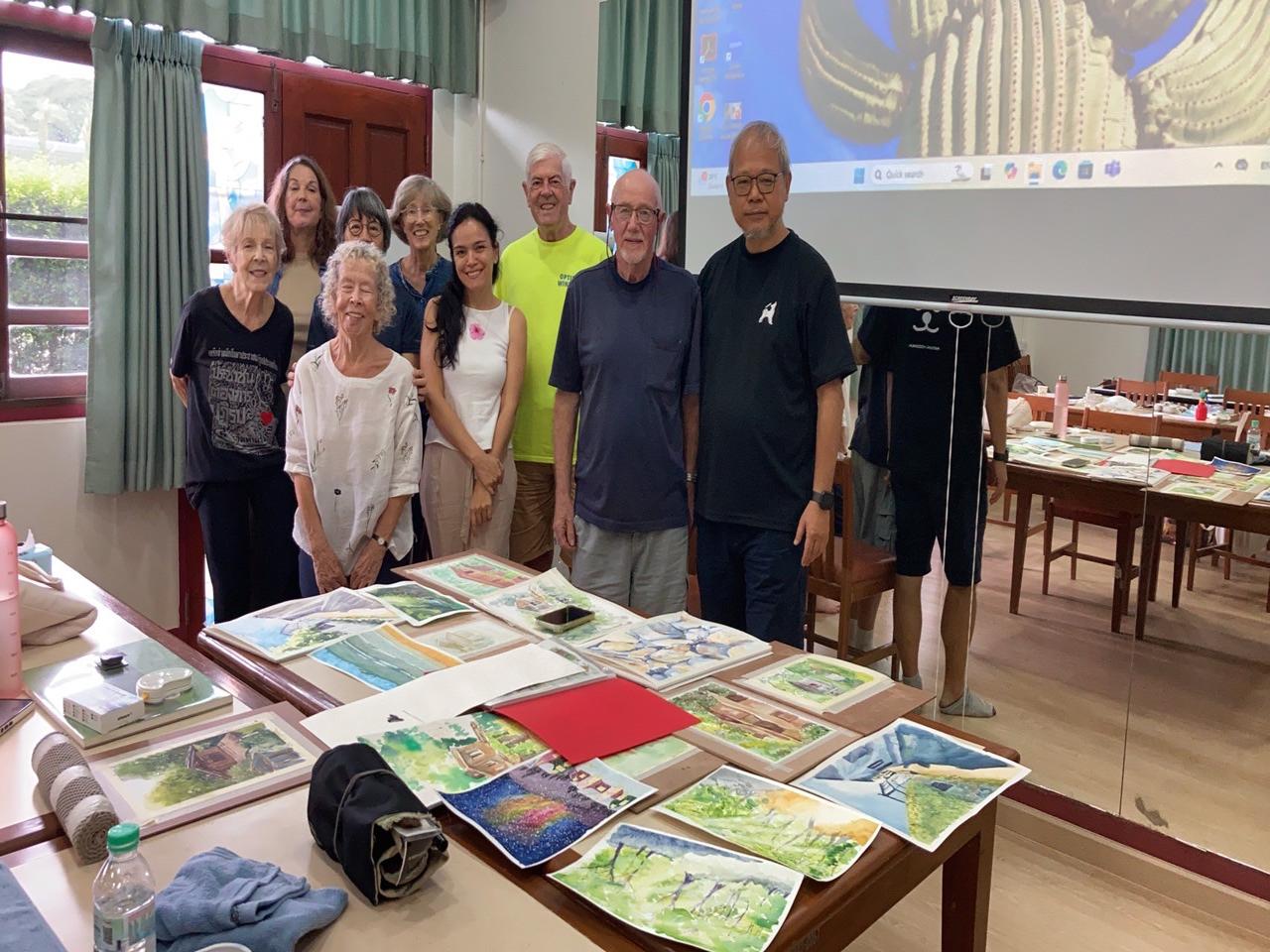 baker-12 Group photo of watercolor students with their finished works, led by instructor Richie Cheung.