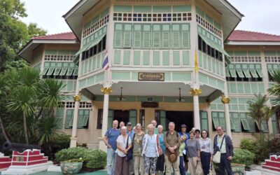 The excursion group posing in front of the historic teak building at Baan Pong Nak.