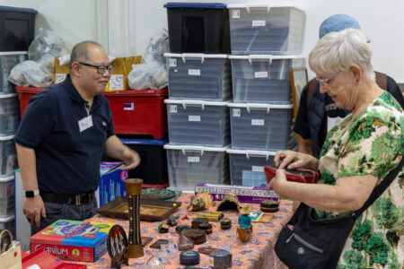 Buying a trinket at the Lifelong Learning Payap Open House sale