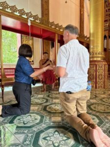Shan History and Culture kneeling in temple