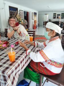 Excursion to Tai Khuen, Tai Yong, and Tai Lue Communities 2 people meeting