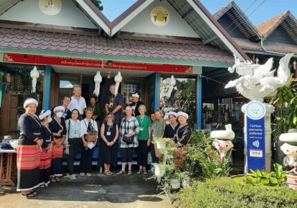 Excursion to Tai Khuen, Tai Yong, and Tai Lue Communities group outside building