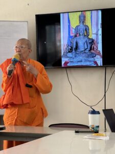Buddhist nun giving a lecture at Songdhammakalyani Monastery, Thailand