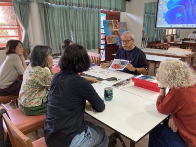 Art Instructor Leading a Discussion on Visual Concepts.