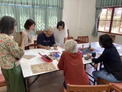 Instructor Demonstrating Drawing Techniques.