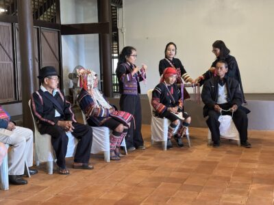 During the Chiang Rai excursion, participants observed a traditional cultural demonstration where local villagers, dressed in colorful tribal attire, shared the process of crafting intricate accessories. The image captures community members showcasing their skills while explaining the cultural significance of the craft, highlighting the importance of preserving local traditions.