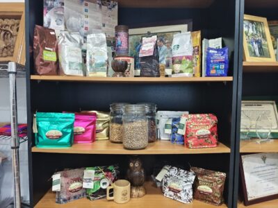 A display of Lanna Coffee products highlights the organization’s history and commitment to ethical coffee production.