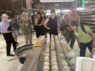 Learning about Lampang's famous ceramic craftsmanship and the traditional processes behind its production.